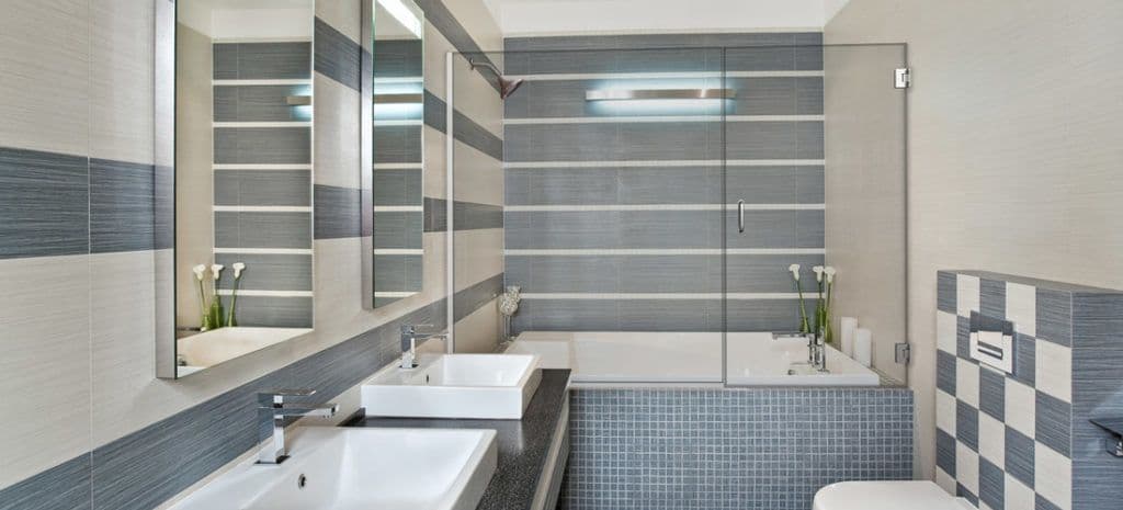 Modern bathroom featuring custom glass shower doors