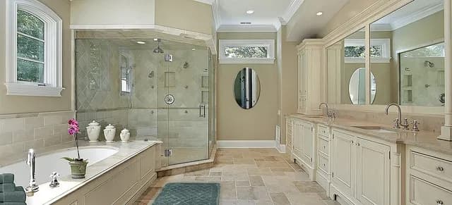 Elegant bathroom featuring custom glass shower doors