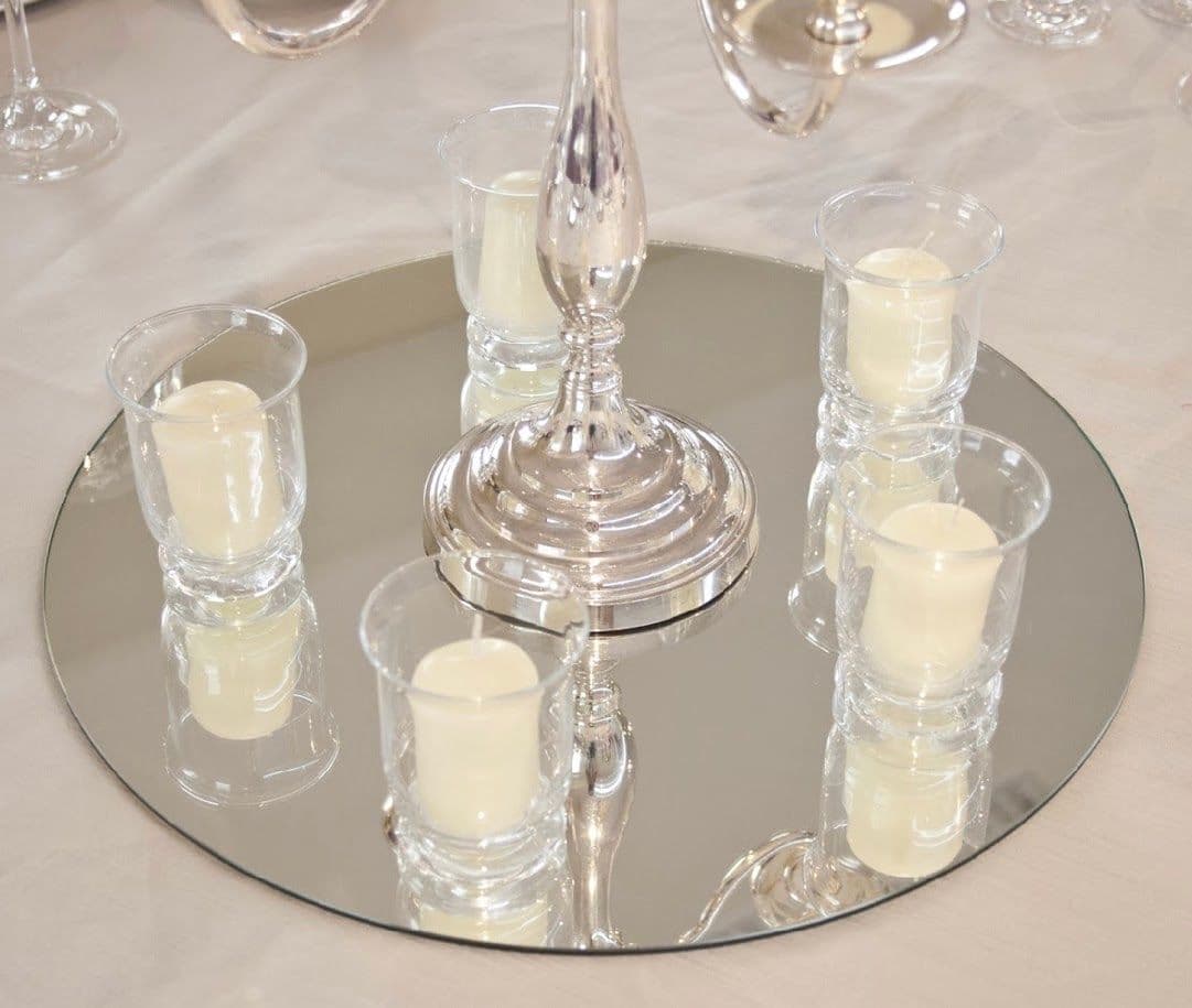 Custom beveled glass table top featuring silver candlesticks and candle holders, ideal for enhancing home decor.