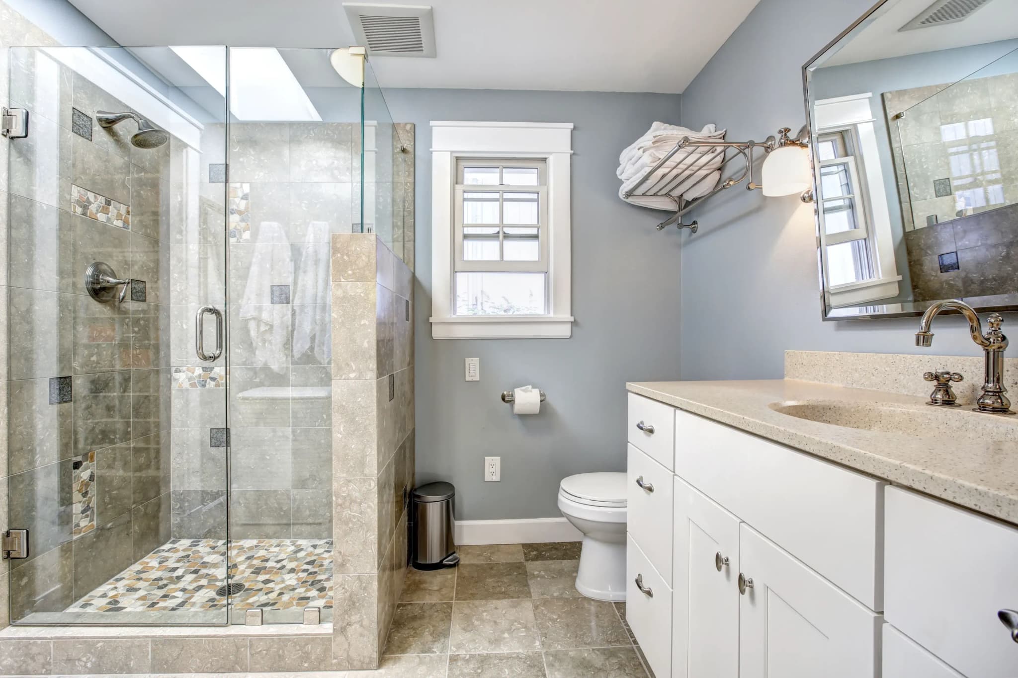 Contemporary bathroom featuring custom glass shower doors