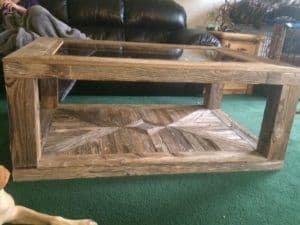 Custom glass table top on a rustic wooden coffee table