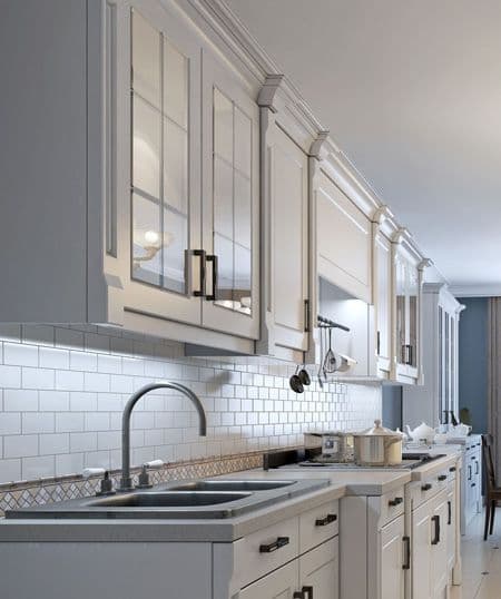 Modern kitchen featuring custom glass cabinet doors
