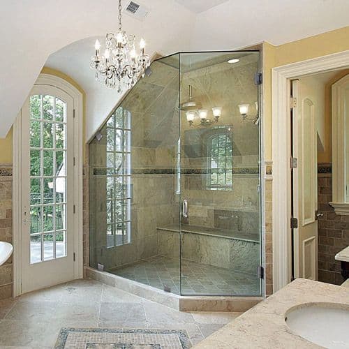 Elegant bathroom featuring a custom glass shower door