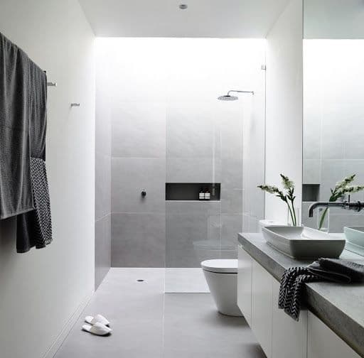 Modern bathroom featuring custom glass shower doors