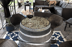 Custom glass table top on a unique barrel base