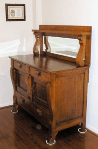 Antique wooden dresser with a mirror