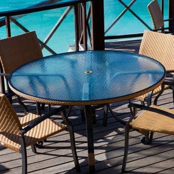 Custom glass table top featuring textured blue tempered glass