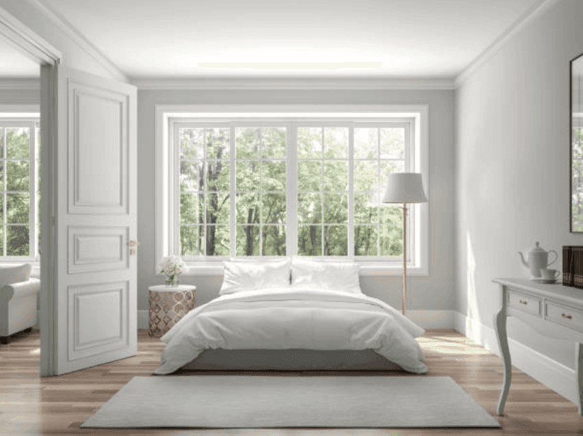 Bright and serene bedroom featuring large windows