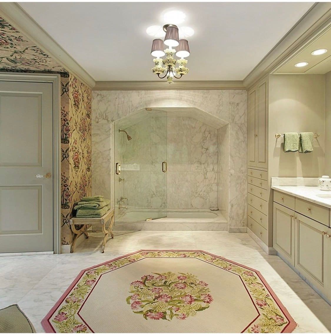 Luxury bathroom featuring custom glass shower doors