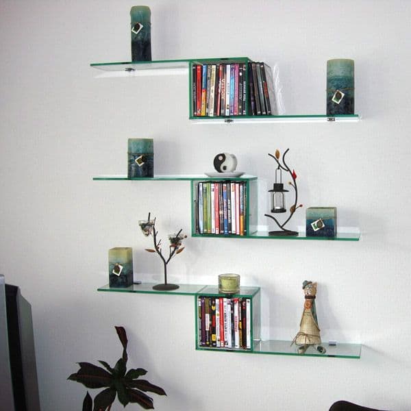 Custom glass shelves showcasing decorative items and candles