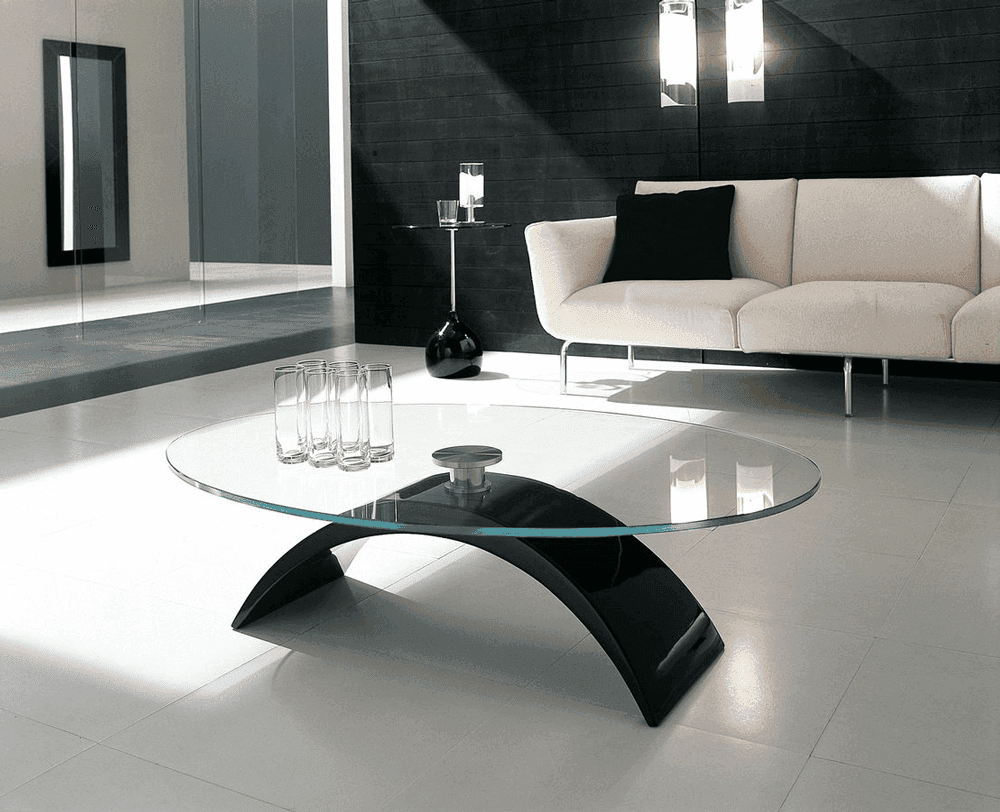 Modern living room featuring a sleek glass coffee table with a black base
