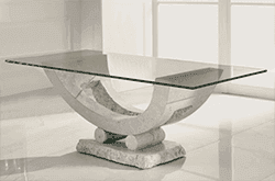 Custom glass table top featuring a unique base design