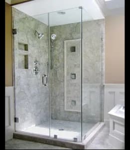 Tempered glass shower doors in a luxurious bathroom setting, featuring a sleek design and modern fixtures, ideal for showcasing custom glass solutions.