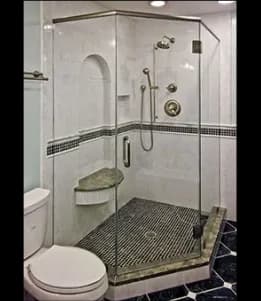 Custom glass shower doors featuring a sleek design, showcasing tempered glass panels and a modern tile layout.