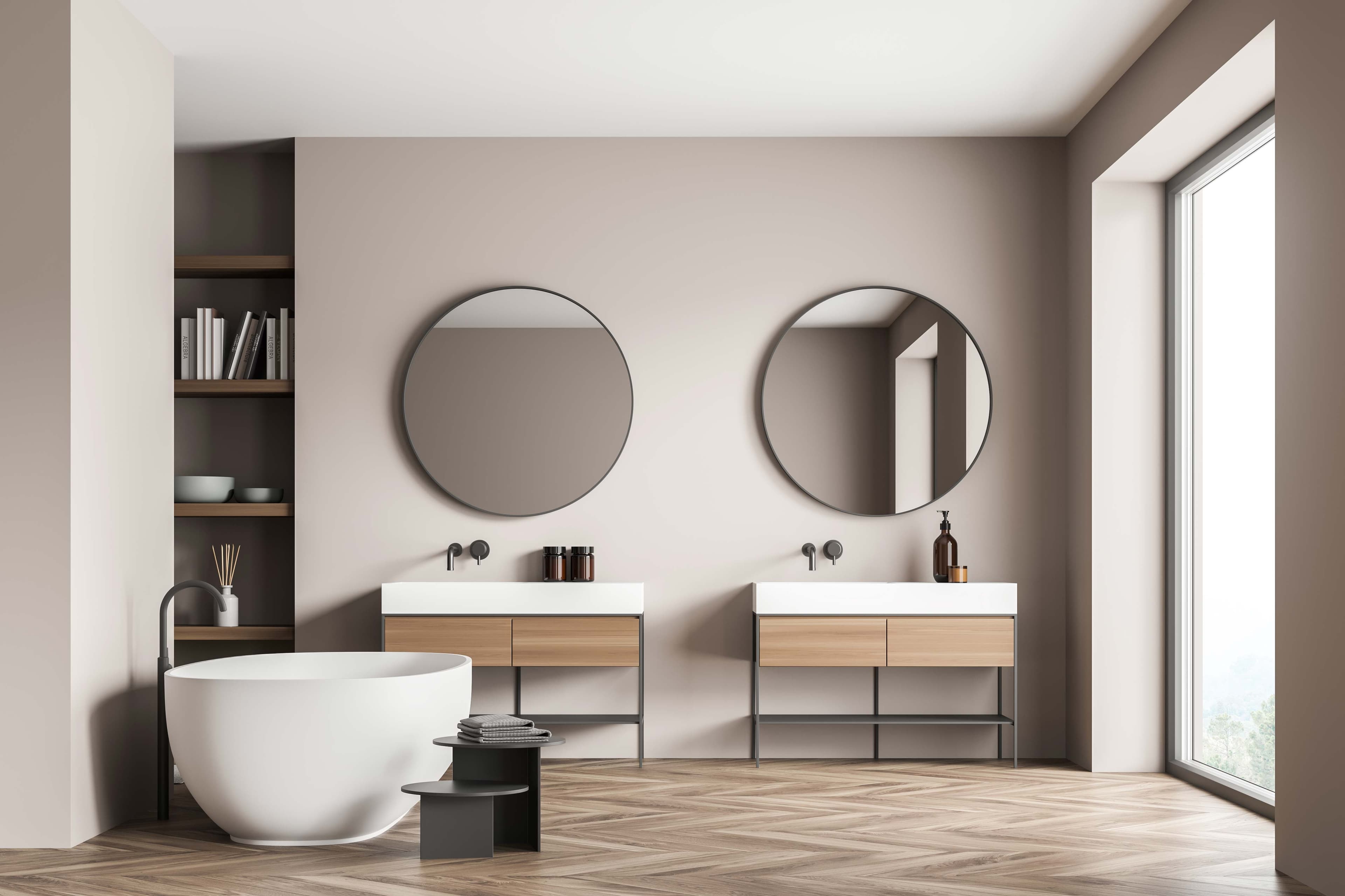 Modern bathroom design featuring round mirrors, a freestanding tub, and wooden vanities, showcasing custom glass elements like tempered glass and beveled glass edges in a stylish setting.