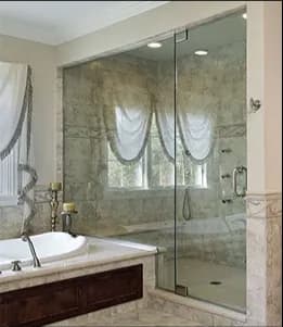 Custom shower doors with tempered glass in a modern bathroom, showcasing elegant design and functionality, ideal for enhancing spaces with custom glass solutions.