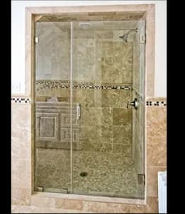 Custom shower doors featuring tempered glass for elegant bathroom design, showcasing sleek lines and a modern finish.
