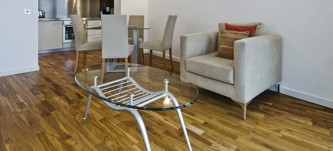 Modern living room featuring a stylish glass coffee table with a tempered glass top