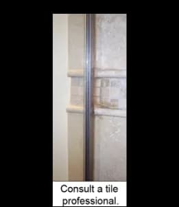 Custom glass shower doors with a sleek design, showcasing tempered glass and a beveled glass edge for an elegant finish.