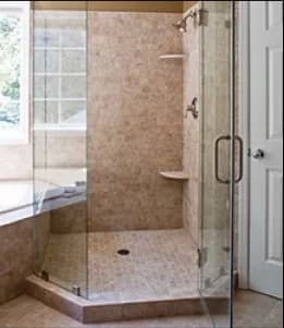 Custom shower doors featuring tempered glass, beautifully designed for a modern bathroom, showcasing a sleek design and practicality.