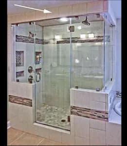 Custom glass shower doors featuring tempered glass and upscale design elements, complementing modern bathroom aesthetics.