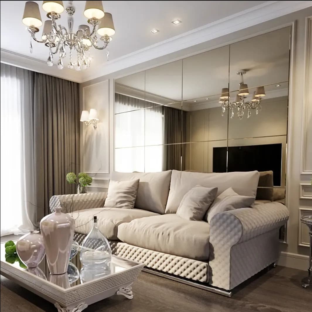 Modern living room featuring elegant mirrors, custom glass table tops, and stylish decor, highlighting the use of glass elements in interior design.