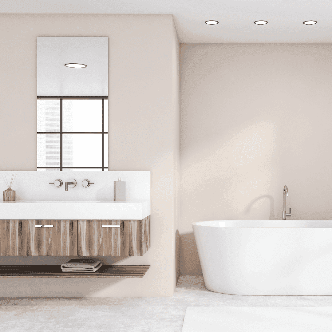 Modern bathroom interior featuring a custom mirror, sleek wooden vanity, and elegant freestanding tub with natural light; ideal for showcasing shower doors, table tops, and beveled glass edge designs.