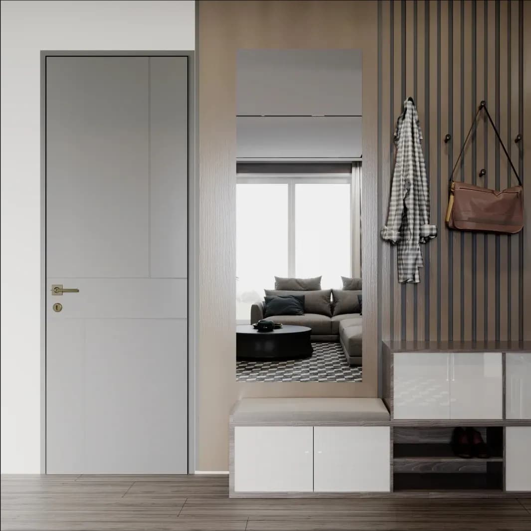 Modern entryway featuring a stylish mirror, sleek cabinetry, and a minimalist design that highlights custom glass elements, suitable for shower doors, table tops, and beveled glass edges.