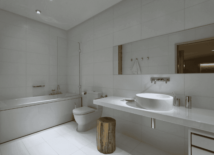 Modern bathroom featuring a sleek design with a large mirror