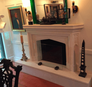 Elegant living room featuring a custom glass fireplace screen
