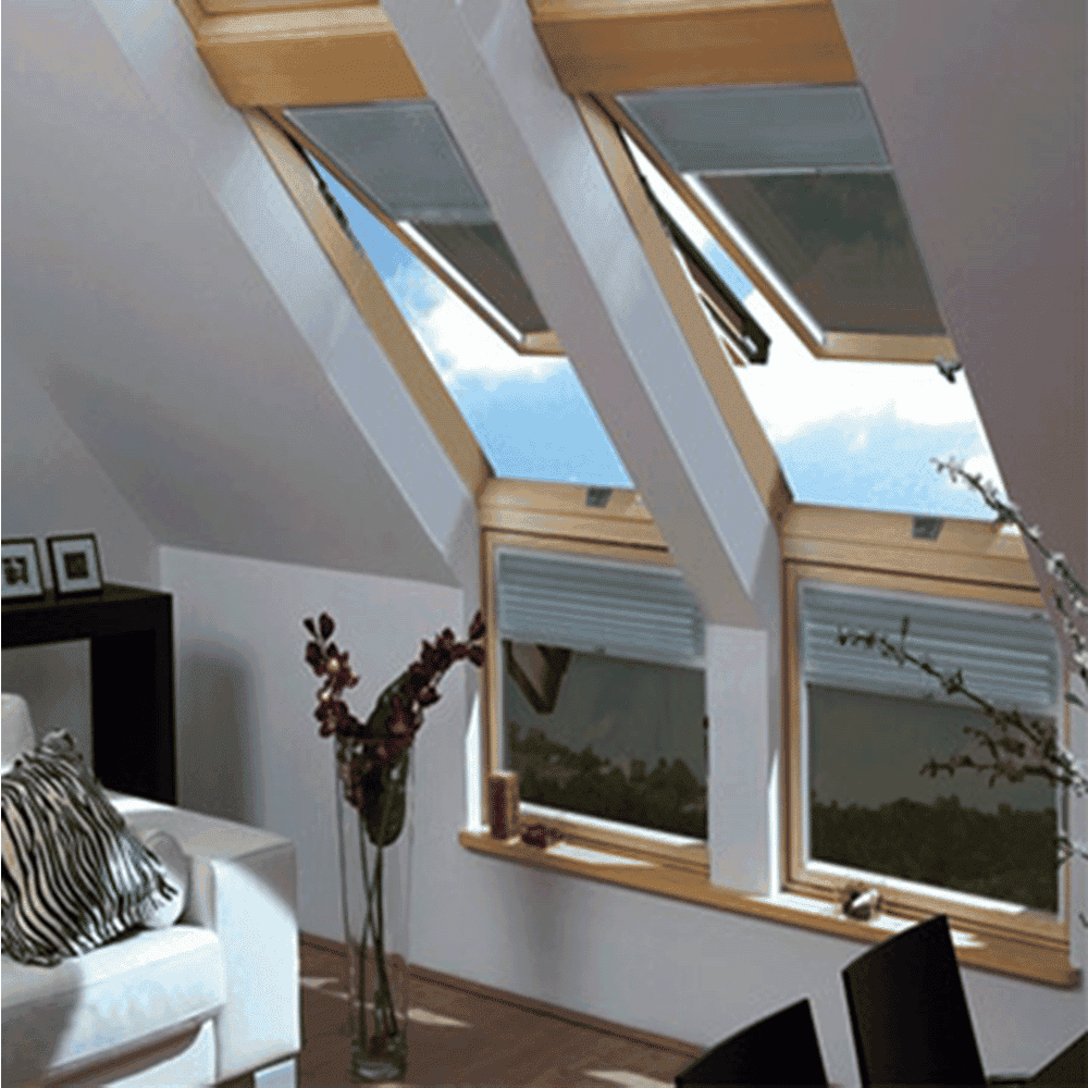 Bright living space featuring skylights and elegant decor, with potential for custom glass solutions like shower doors, table tops, mirrors, and tempered glass accents.