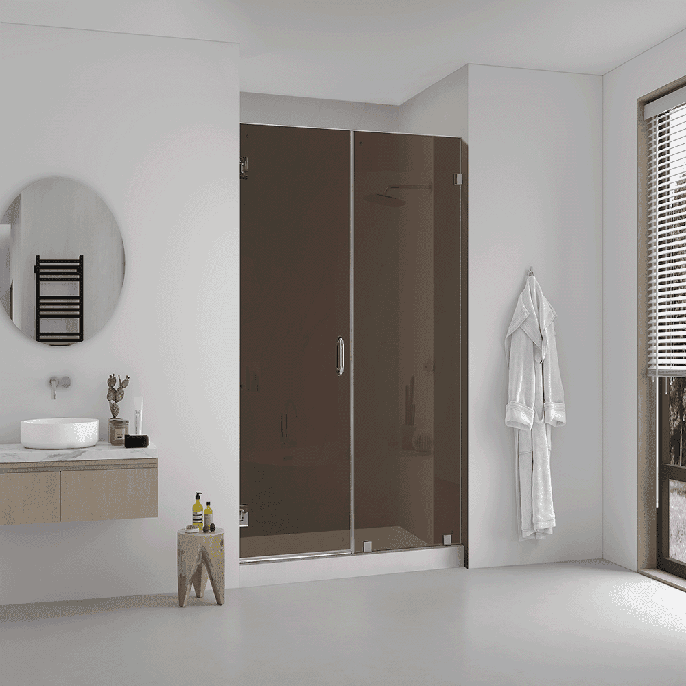 Modern bathroom featuring custom glass shower doors, a sleek round mirror, stylish vanity with a marble countertop, and ample natural light, highlighting tempered and beveled glass design elements.