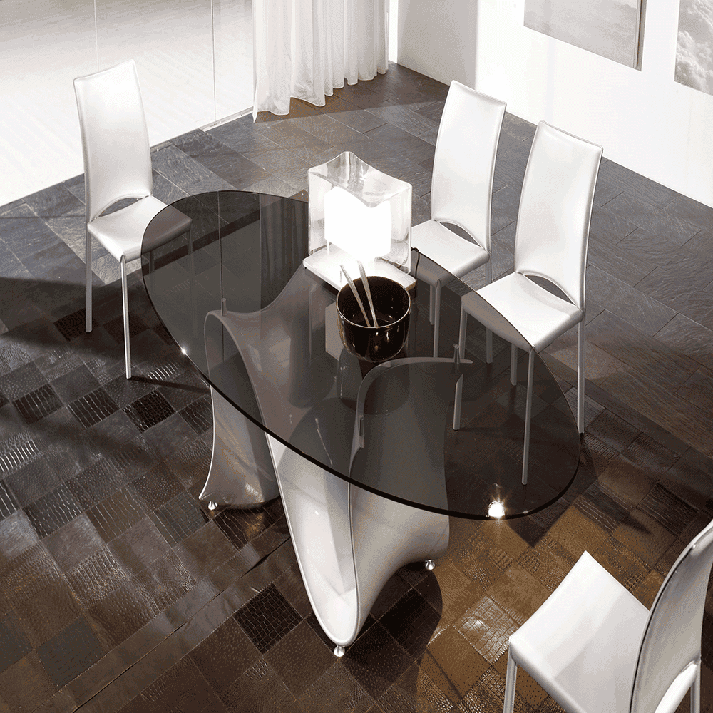 Elegant oval glass table with a sleek black tempered glass top, surrounded by modern white chairs, showcasing custom glass design.