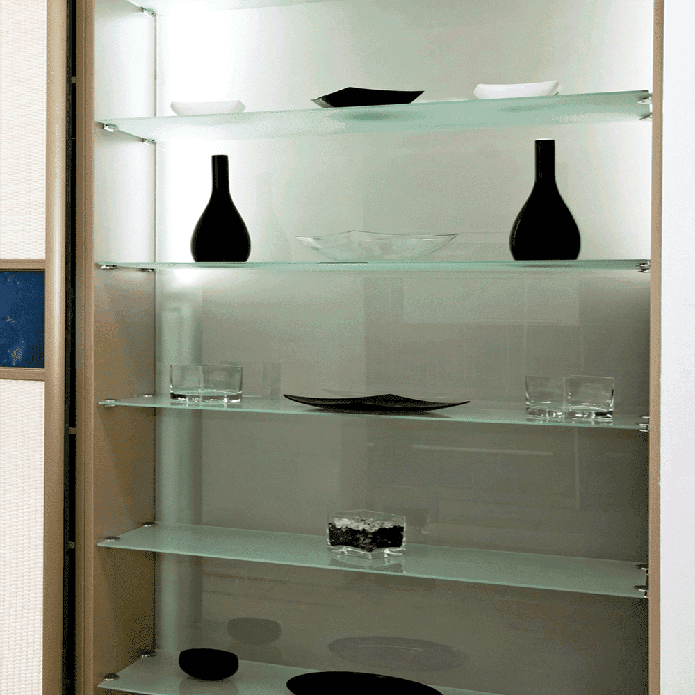 Custom glass shelving with tempered glass and beveled glass edges displaying decorative items and tableware.