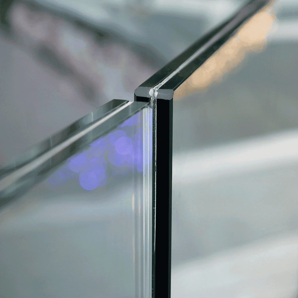 Tempered glass corner detail showcasing a sleek finish for custom shower doors, table tops, and mirrors with a beveled glass edge.