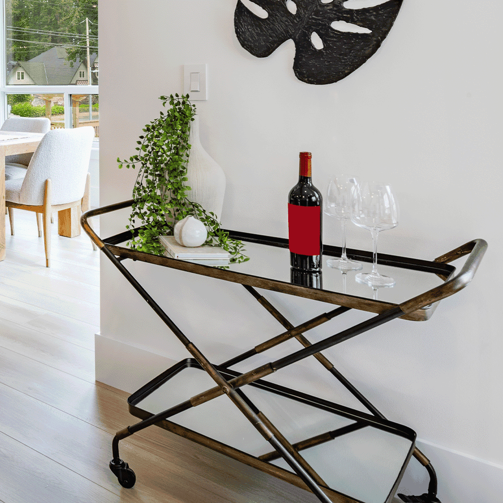 Stylish entryway with a rolling bar cart featuring a custom glass top