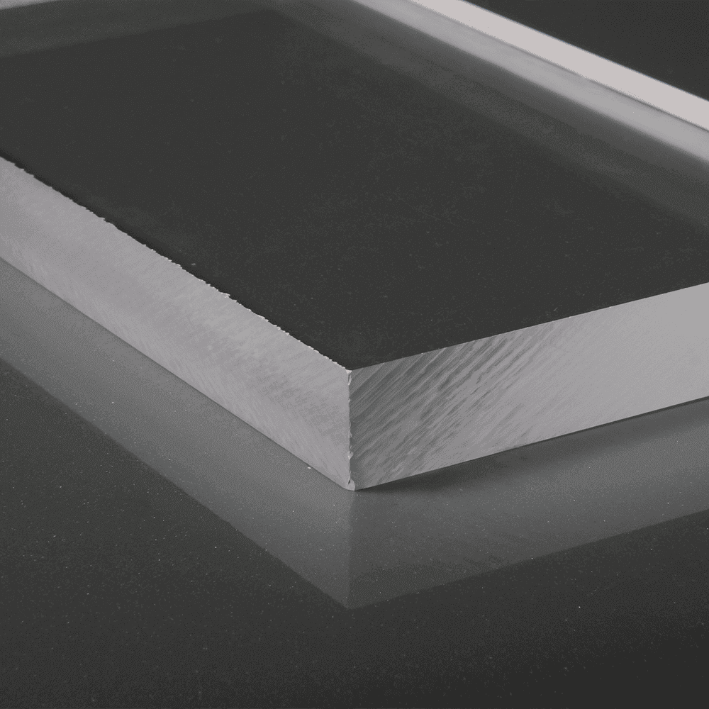 beveled glass edge of a custom glass table top reflecting on a dark surface, showcasing quality tempered glass craftsmanship for shower doors and mirrors