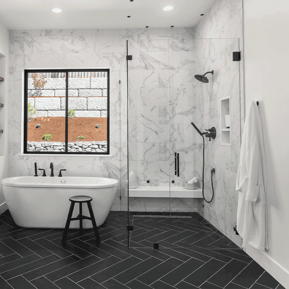 Modern bathroom featuring custom glass shower doors
