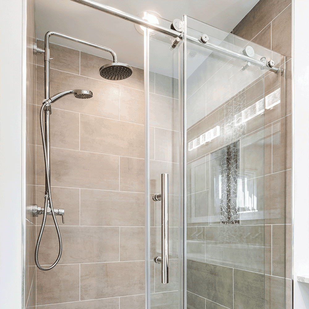 Custom glass shower doors featuring a sleek design, ideal for modern bathrooms, showcasing tempered glass for durability and elegance.