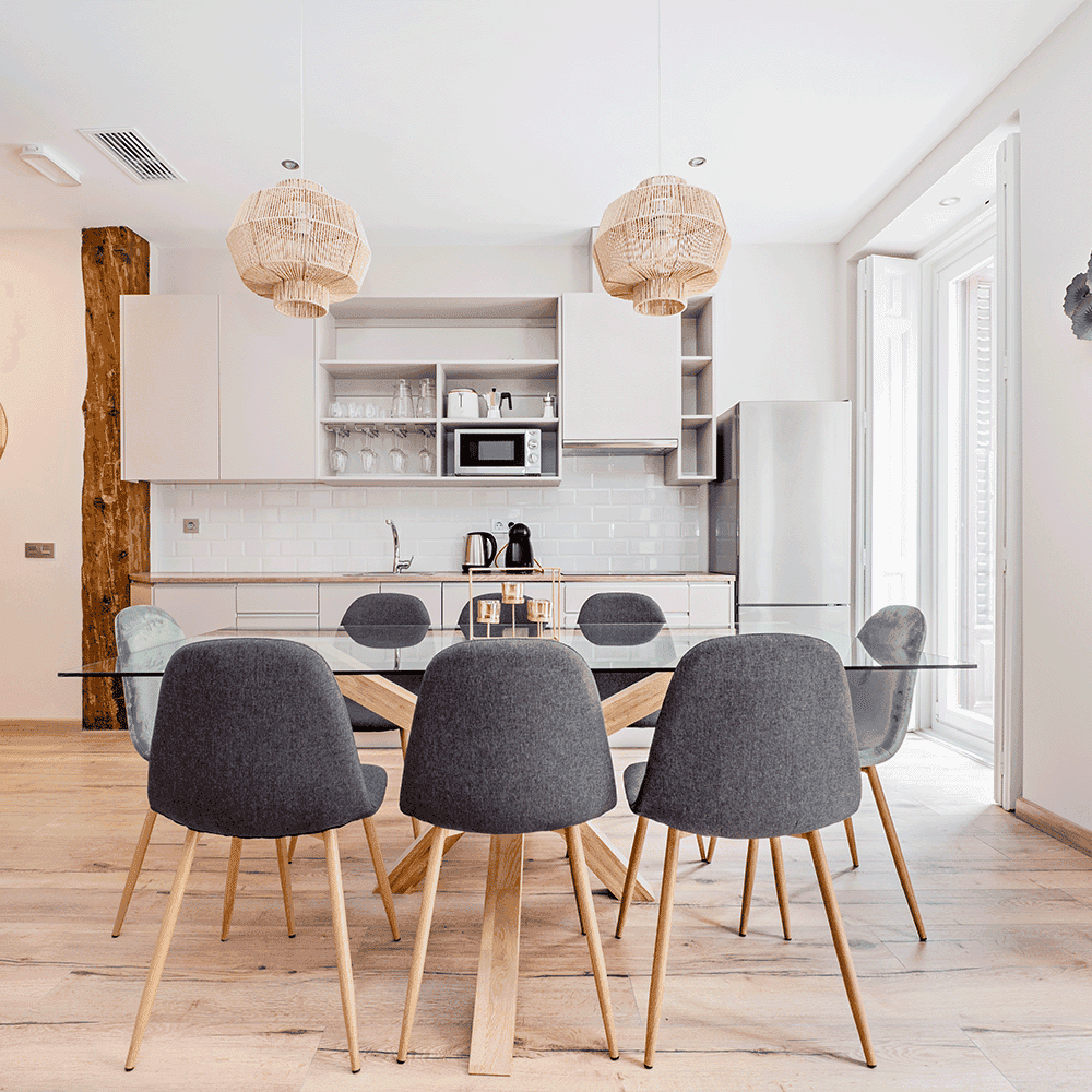 Modern kitchen featuring a glass table top with a stylish design