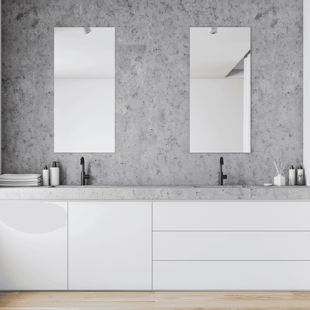 Elegant bathroom featuring custom mirrors above a sleek countertop