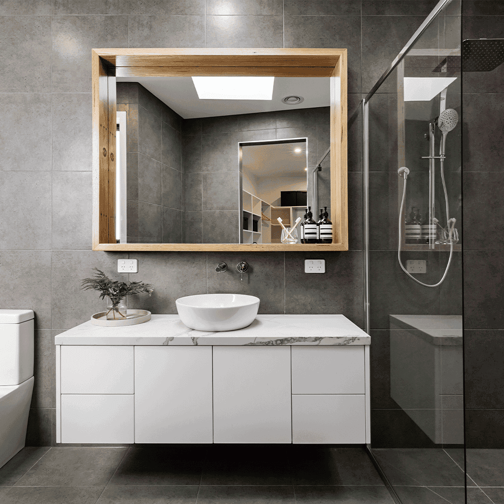 Modern bathroom featuring custom glass shower doors