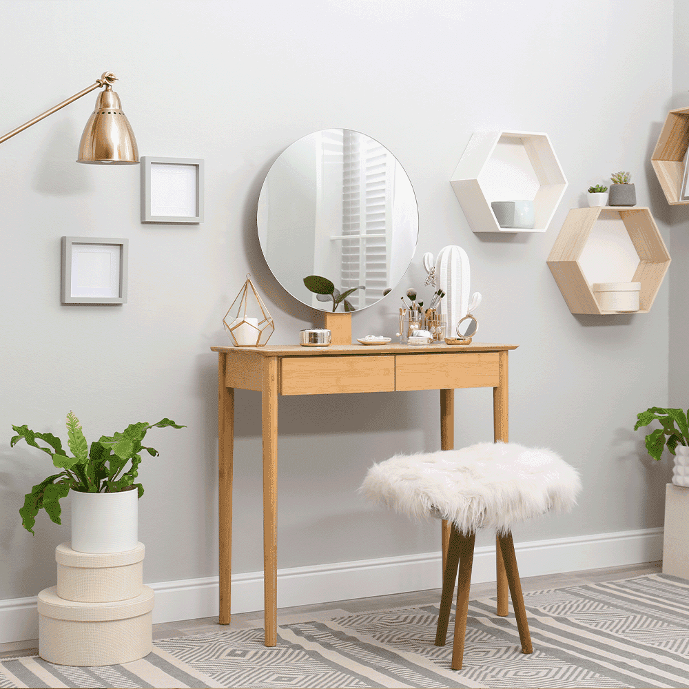 Contemporary vanity setup featuring a round mirror