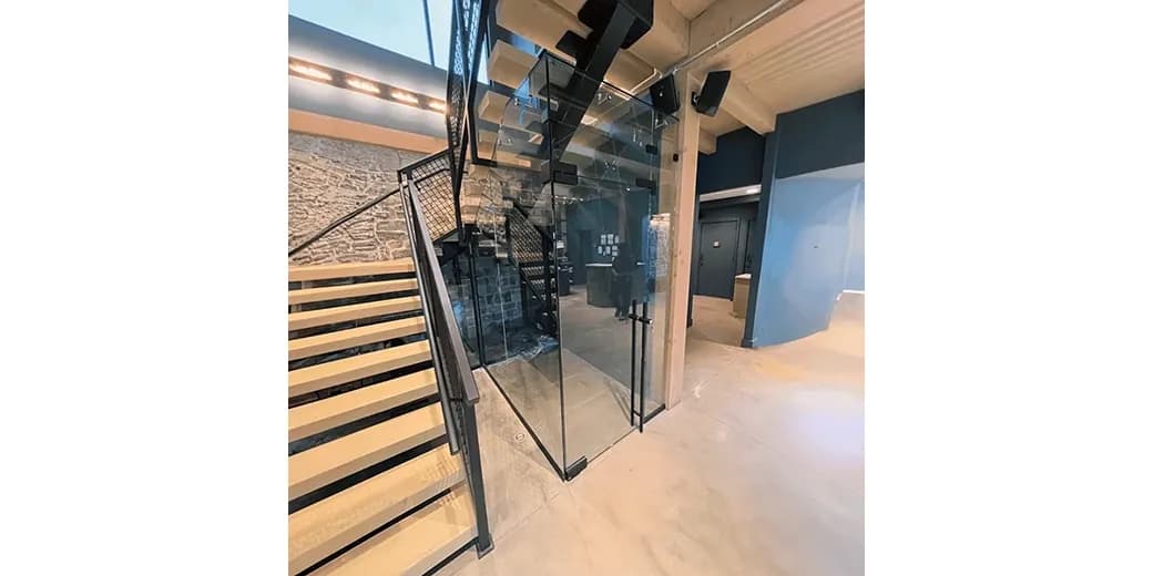 Custom glass shower door installation featuring tempered glass for modern interiors, with a focus on sleek design and functionality.
