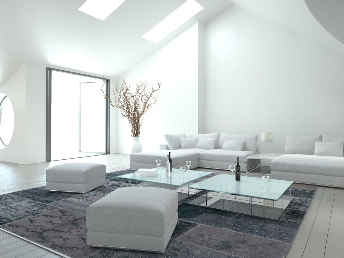 Modern living room featuring a stylish glass table top, with natural light illuminating custom glass decor, ideal for showcasing tempered glass and beveled glass edge designs.