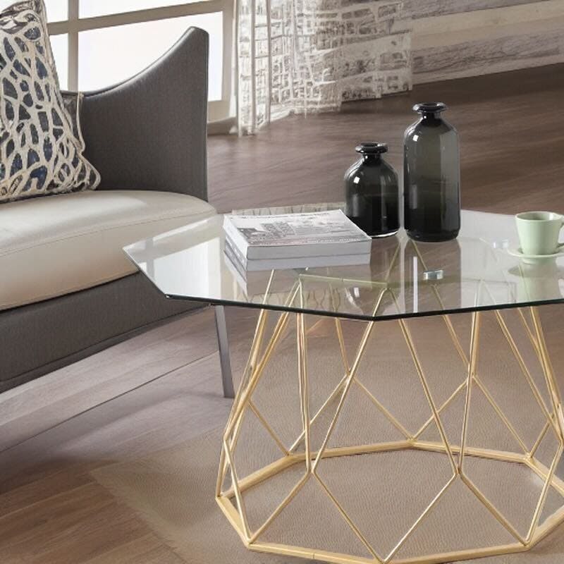 Hexagon tabletop with gold leg frames in living room\