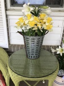 Wicker table with green-yellow paint