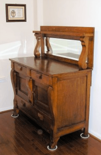 beveled-mirror-on-antique-buffet.png