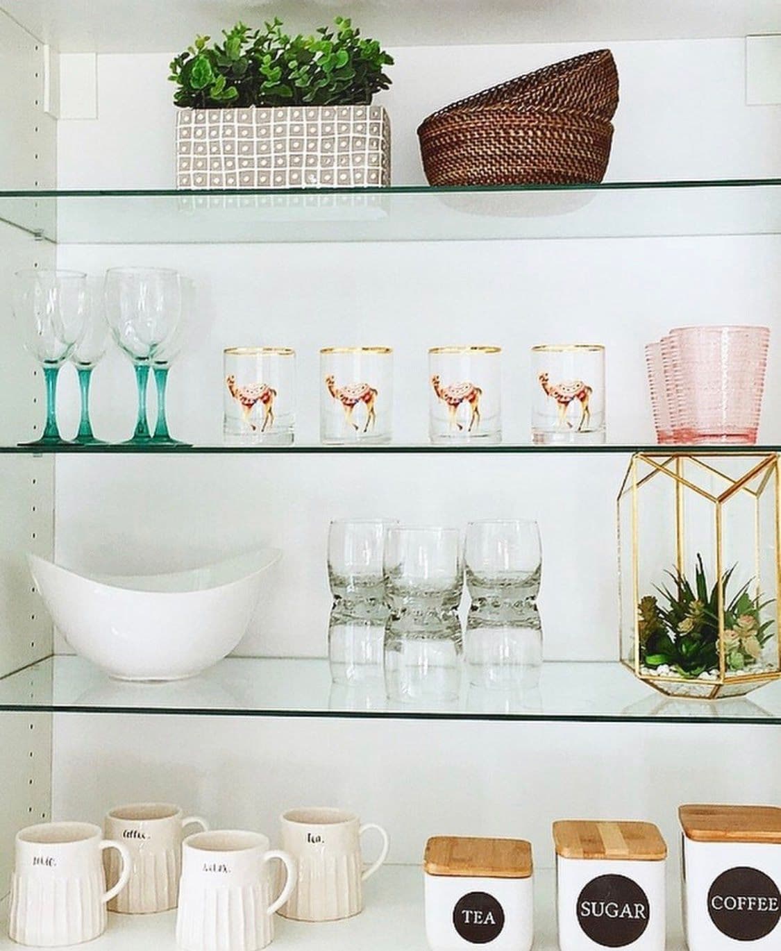 Custom glass shelving displaying various glassware