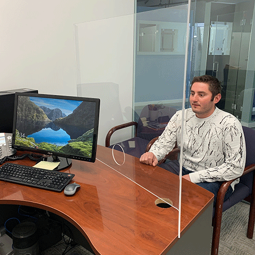 Custom glass office divider providing safety and privacy; featuring tempered glass ideal for modern workspace design.